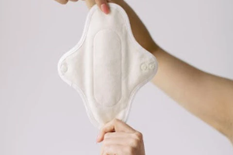 Closeup of woman holding a hannahpad