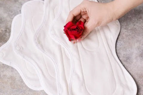 Close up of a rose placed on varying sizes of hannahpads.