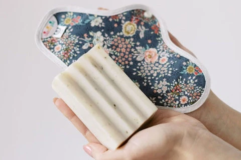 A hannahpad next to a bar of soap