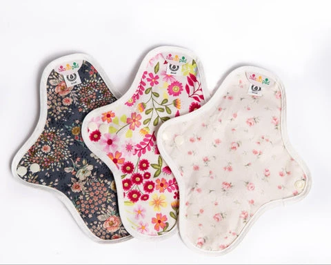 Close up of three hannahpad cloth menstrual pads